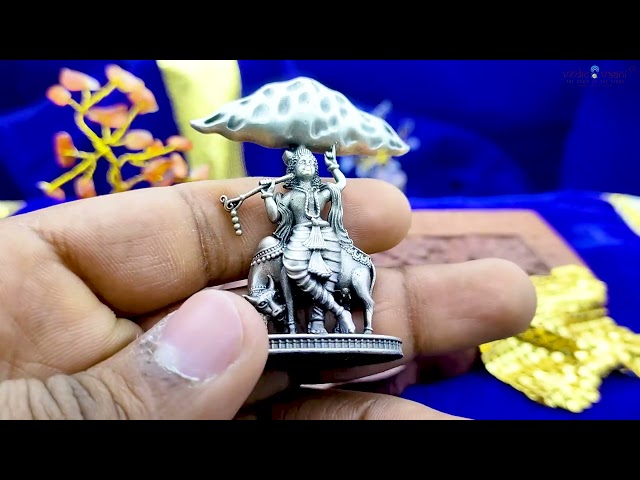Lord Krishna Holding Govardhan Parvat Idol in Silver video