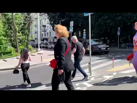 People rush for cover as explosions heard in Kyiv