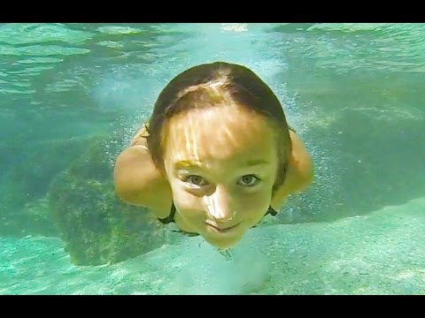 Carla Underwater in a natural swimming pool 