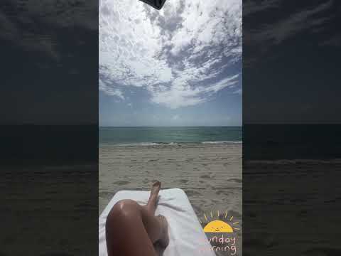 Dan Bilzerian girl resting on beach