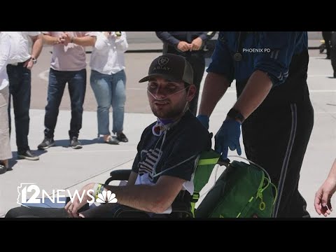 Community welcomes home Officer Tyler Moldovan after his release from rehab facility