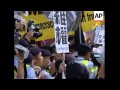 Pro-democracy protesters scuffle with riot police, Falun Gong group marching