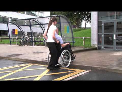 How to use a manual wheelchair - Part 6 Moving up and down kerbs