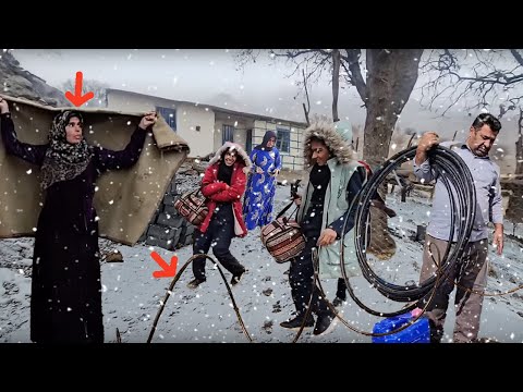 Working in a snowy day: pipes of Fariba's house are installed