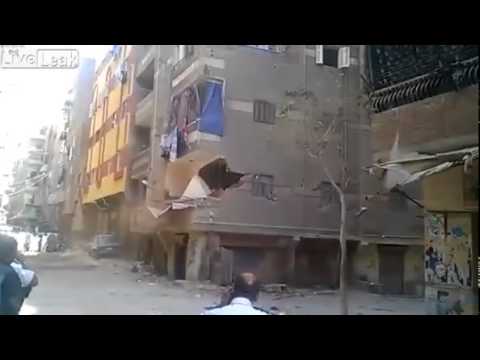 Watch dramatic moment tower block collapses in shower of dust and rubble