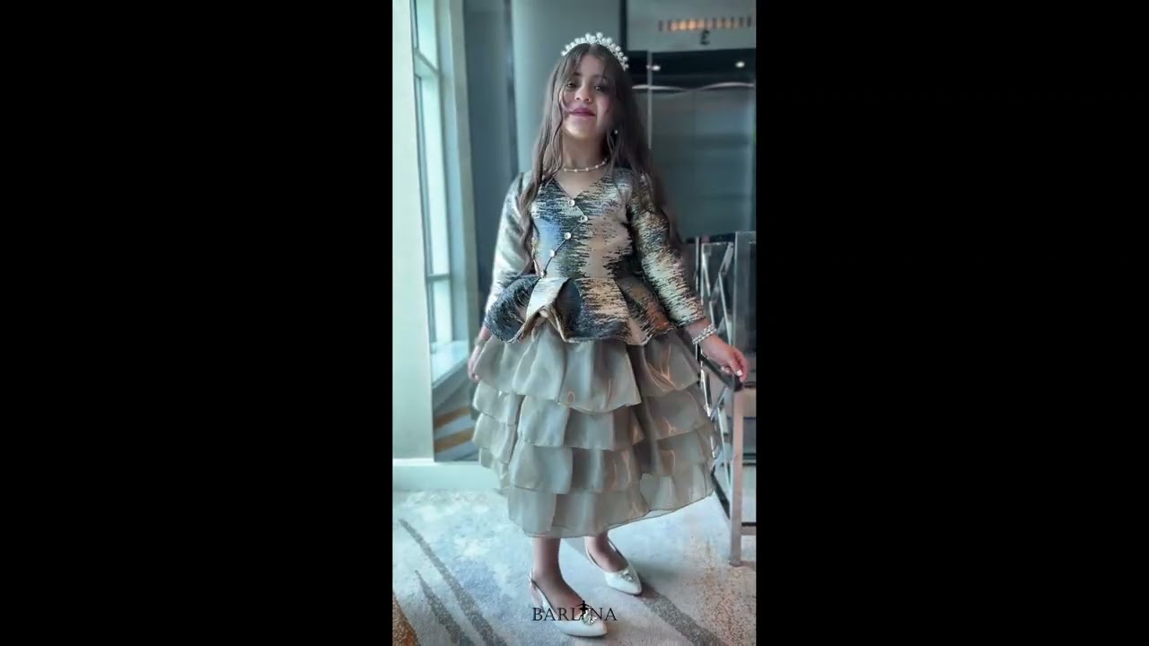 Light green girls' dress with an artistic pattern - year 1