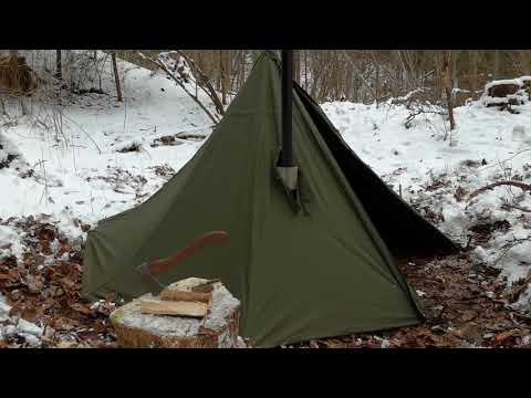 Im Polnischen  Lavvu  mit Zeltofen den Winterwald genießen.