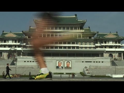 High-fives and presidential portraits at Pyongyang Marathon