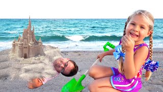 Diana and Roma have fun on the Beach with Daddy