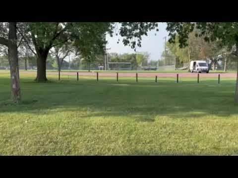 Puff running back to the van from the pond  note baseball fields
