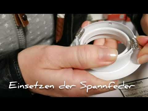 Einsetzen der Spannfeder bei einem Einbauspot oder Einbaustrahler