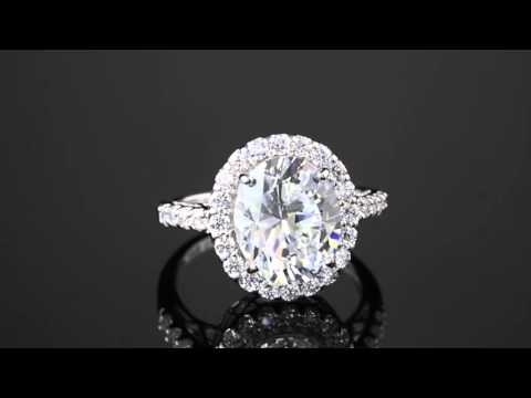4.44 TCW Oval Cut Cubic Zirconia Platinum Over Sterling Silver Halo Ring