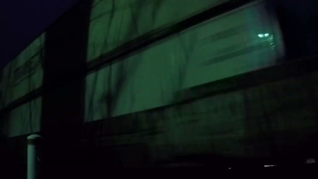 Southbound cn intermodal train passes pedestrian crossing