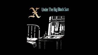 X under the big black sun