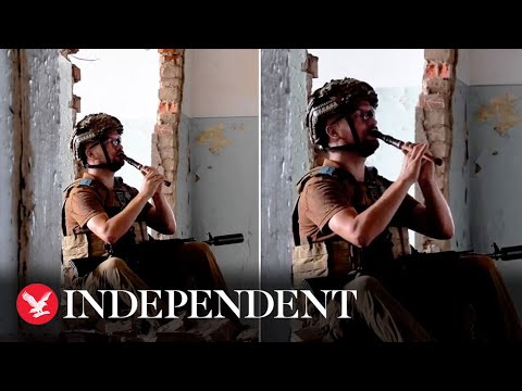 Ukrainian soldier plays haunting music inside ruins of bombed-out building