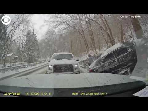 Close call! Pickup drifts on icy road and slams right into emergency vehicle in Pennsylvania
