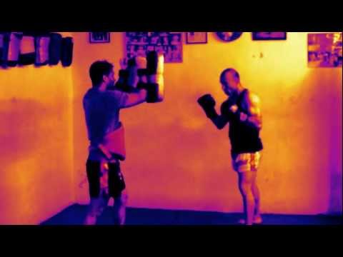 Maldonado is showing some techniques with the thai boxing pads...
