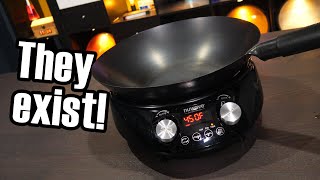 The bowl-shaped induction base with round-bottom carbon steel wok seated inside it