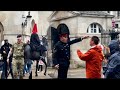 ANGRY BOSS & SOLDIER SCREAMED, but guard uses his horse and LOUD VOICE to move the tourists away