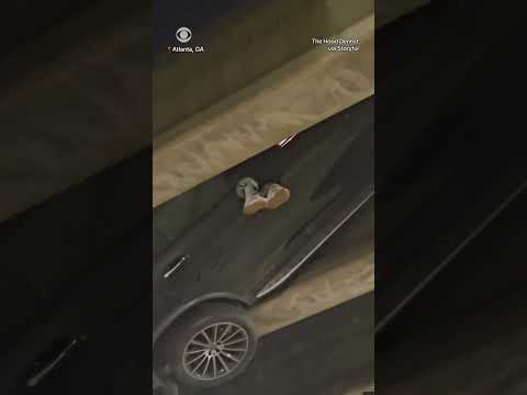 Driver seen dangling from car after car crash #shorts