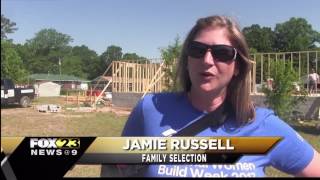 Women help build a home for a local family