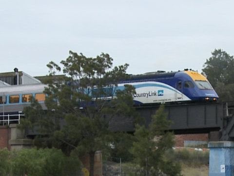 Countrylink XPT passenger train crossing a bridge in Melbourne Australia