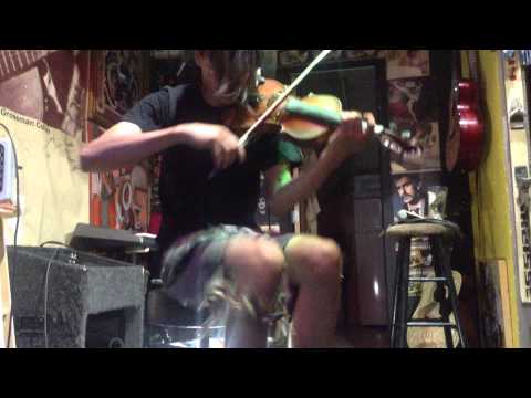 Joey Molinaro saws a fiddle in half at Back Alley Gallery Okc