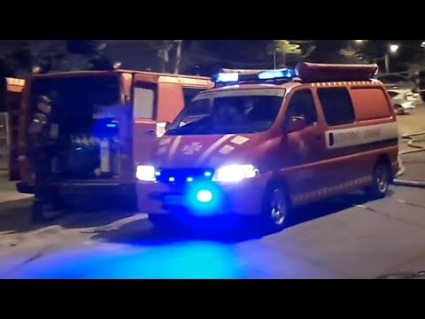 Gas & smoke protection squad + command van arrived on scene of fire with blue lights