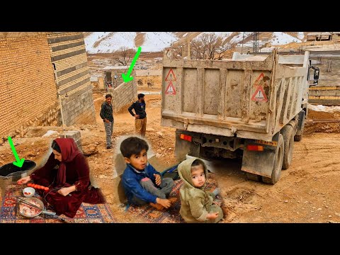 Struggling in the Cold; Kayvan and Zahra spend a hard day bringing sand and building a room
