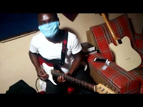 The man behind guitar on Yesu ni moto song.