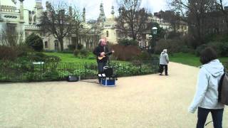 Busker singing the Neil diamond song  -You are the Sun,  I am the moon in Brighton Pavillion Gardens