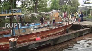 Netherlands: People journey on Amsterdam canals in Lampedusa migrant crossing experience