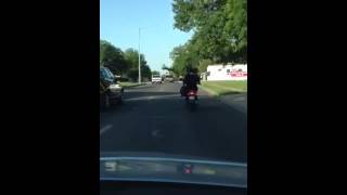 Crazy fool fighting on top of car