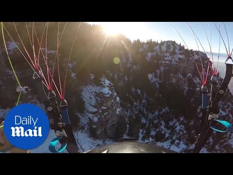Paraglider Bridger Henriksen nearly collides with trees - Daily Mail