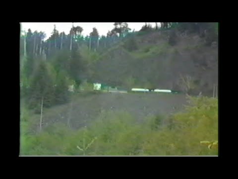 124. AMTRAK # 14 with SP HELPER at west Fields Oregon in May 1985 with 1 freight and 2 passenger