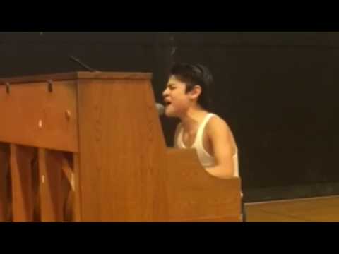 Kid performs Bohemian Rhapsody in front of whole school!