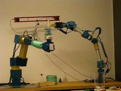 Robot arms open bottle and pour (zoomed out)
