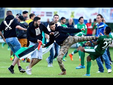 Shocking moment fans invade pitch and force players to flee stadium