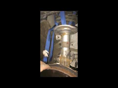 Part of a video titled Cheap & Easy Spring Compressor - DIY - YouTube