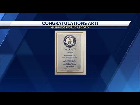 Art Jarrett receives certificate for Guinness World Record during Rokerthon