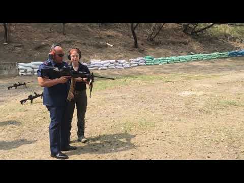 PNP Chief Ronald Dela Rosa firing a Negev Machine Gun