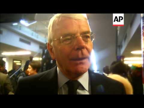 Former British PMs Tony Balir and John Major arrive for Mandela memorial; Major comments