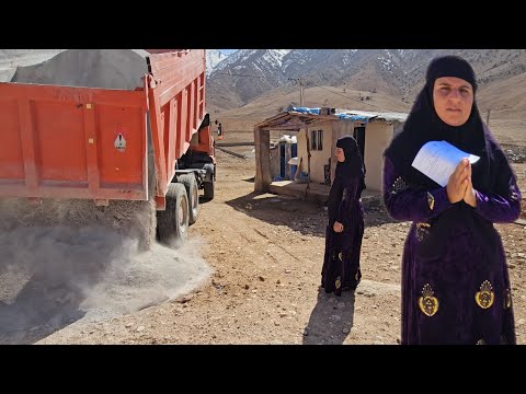 A single woman, a truckload of sand, a difficult life.