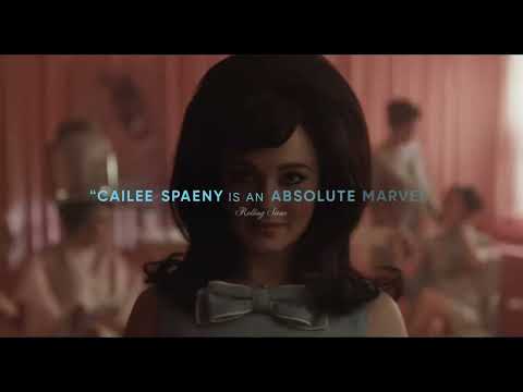 Close-up of a first kiss as the frame blurs and a future-era guitar tremolo blooms