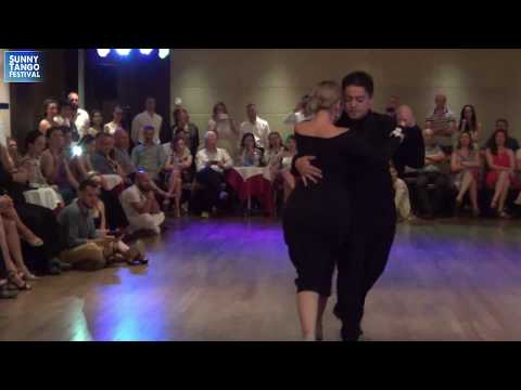  Carlos Espinoza  and  Noelia Hurtado Pitruzzella  are  dancing  to  the  tango  "  Volvamos a Empezar  "  by  Alfredo De Angelis  at  Sunny Tango Festival  in  2019