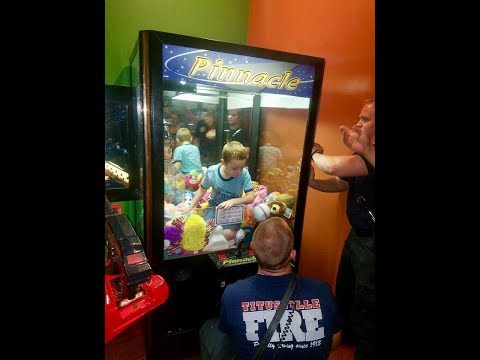 Firemen Rescue Small Child from Claw Toy Machine