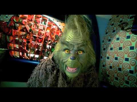 Trailer frame: candy-colored Whoville streets underlined by pop cues and Horner’s twinkling score