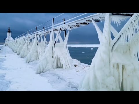 Storm Leaves Michigan Lighthouse and Pier Covered in Ice