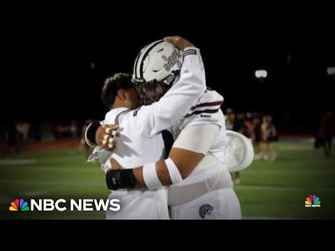 Unexpected homecoming: Navy sailor surprises his brother on football field