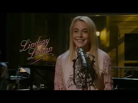 Trailer still — Dusty & Lefty on mic, band swinging behind them as the crowd claps time